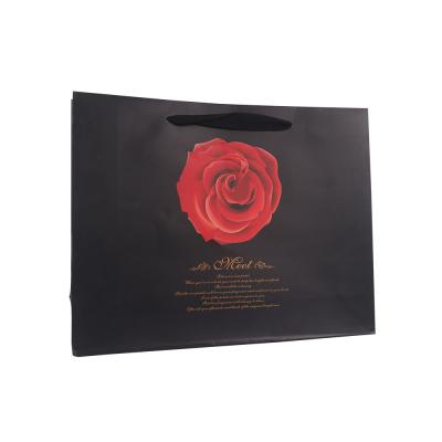 China Recycled Materials Paper Bag Packaging Gift Paper Bag Black Paper Bags for sale