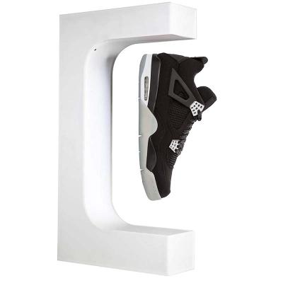 China Custom Logo Factory Supply High Quality Eco-friendly Magnet Acrylic Floating Shoes Display Stands For Shops Shoes Display Rack for sale