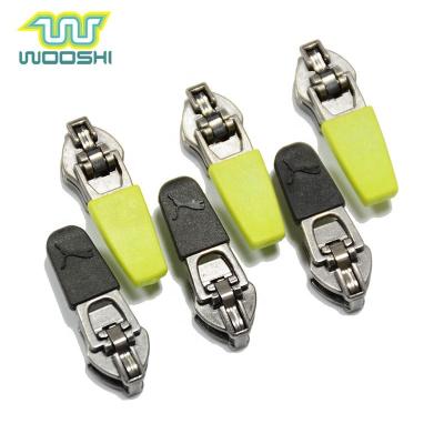 China Nickel Free Garment Pull Custom Design Rubber Zipper Puller Metal Auto Lock Brass Zipper Slider For Leather Jacket for sale