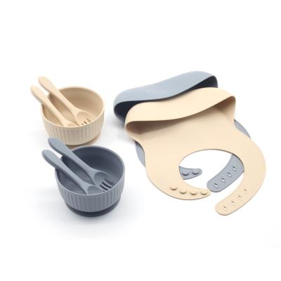 China Hot Selling Microwavable Silicone Spoon And Fork With Strong Silicone Suction Cup And Bib 3 Pieces Set for sale