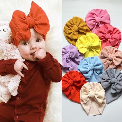 China Messy Baby Accessories Bow Waffle Cotton Bow Baby Turban Headwrap Knit Turban Baby Hair Bow Hospital Newborn Baby Hat for sale