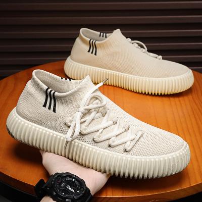 China Fashion trend M2316 best selling products men's fashion sneakers 2023 breathable flying weaving sports shoes running sports shoes for sale