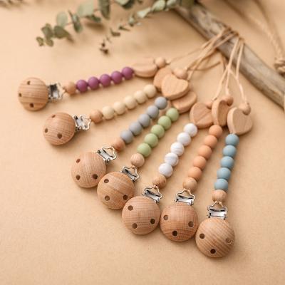 China Pure Wood Pacifier Clip BPA Free Silicone Bead High Quality Wooden Chain Soother Baby Pacifier Clip Bpa Free for sale