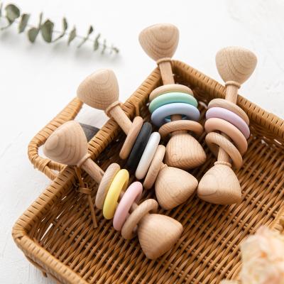 China Musical Toy Baby Wooden Teether Rattle Organic Beech Wood Colored Ring Molar Wooden Toy for sale