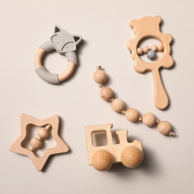 China Handmade Car Toy Baby Teething Wood Wholesale Eco-Friendly Wooden Rattle Baby Toy Set Wooden Teether Hand for sale