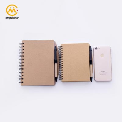 China Wholesale Eco-friendly Kraft Paper OEM Spiral Kraft Paper Cover Journal Notebook With Pen Holder for sale