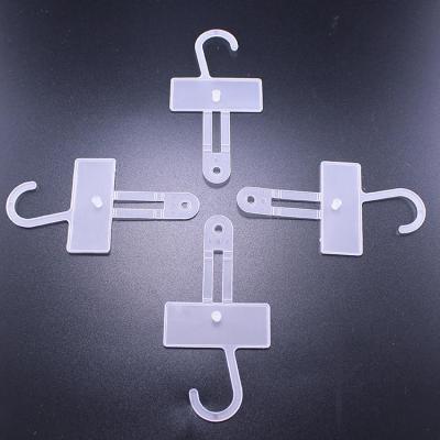 China New small plastic hook hanging hanger material in white color for socks, mittens for sale