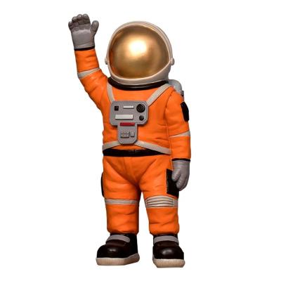 China Beautiful 2021 Resin Landing Astronaut Ornament Small Size In Orange Color Wall Decor Astronauts Crafts for sale