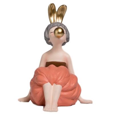 China Europe Hot-selling resin crafts bunny girl ornament in orange color sculpture figurine for home decoration for sale