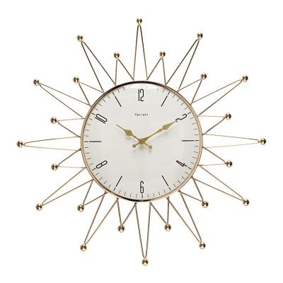 China Beautiful light luxury creative star-shaped wall clock in gold living room dining room home fashion clock for sale