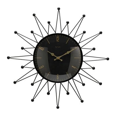 China Beautiful 2021 light luxury creative star-shaped wall clock in the living room dining room home fashion black clock for sale