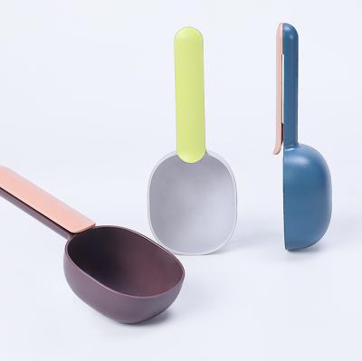 China Plastic Mutli-function Pet Food Shovel Dog Food Stored Feeding Spoon With Sealing Bag Clip Pet Spoon Cup Measuring Supply for sale