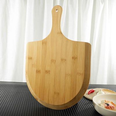 China Sustainable Natural Bamboo Paddle Boards Pizza Skin With Handle For Homemade Pizza And Bread Baking for sale