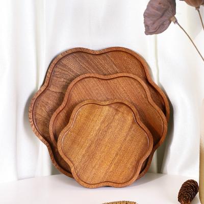 China Viable Petal Form Ebony Fruit Bread Small Household Tray Japanese Dim Sum Steak Serving Tablewere Flower Wooden Dish for sale