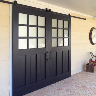 China Decorative Founction Outdoor Sliding Barn Door Patio Door with Window Glass and Sliding Track Wheel System for sale