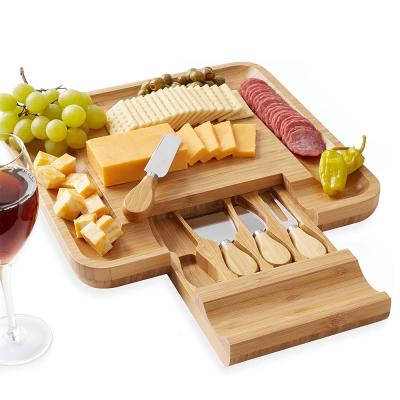 China Sustainable Bamboo Cheese Board Set Serving Panel With A Drawer And Knife Kit for sale