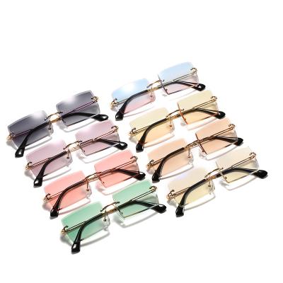 China New Sunlight Balance Rimless Sunglasses 2021 Women Travel Party Colorful Portable Sun Glasses Wholesale for sale