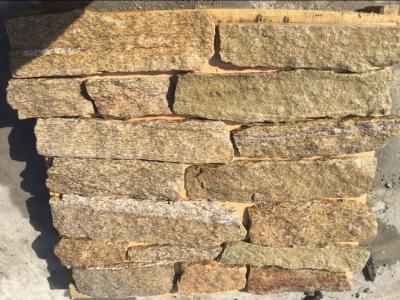 China Tiger Skin Yellow Granite Field Stone Random Granite Stone Veneer Natural Stone Cladding for sale