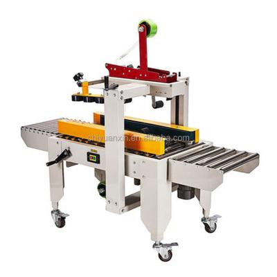 China Food Factory Supplying Postal Express Automatic Stainless Steel Cardboard Strip Sealing Machine for sale