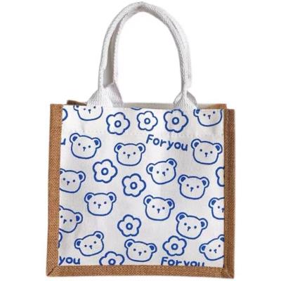 China Easy To Carry Printed And Dyed Good Quality Jute Cartoon Pattern Hand Held Diagonal Cross Bag for sale