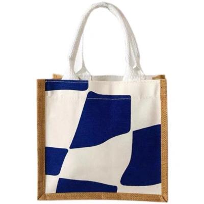 China Easy To Carry Factory Price Blue Milk Cartoon Style Jute Bag for sale