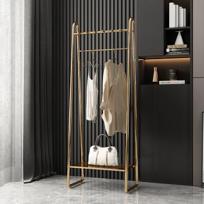 China Newly Stable Nordic Design Clothes Rack Simple Iron Modern Art Hanger Bag Floor Bedroom Household Coat Rack for sale