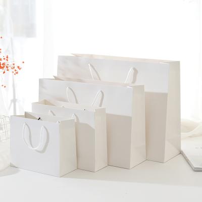 China Eco Design Fancy Handmade Cheap White Packaging Clothes Paper Bag For Shoes for sale