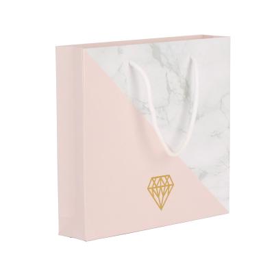 China New Design Handmade Hot Stamping Logo Tote Bag Eco Friendly Foldable Gift Pink Marble Paper Bags for sale