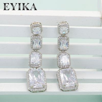 China Luxury White Stone Hiphop CZ Large Crystal Drop Earrings For Wedding Party Diamond Baguette Drop Earrings Exaggerated for sale