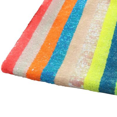 China Dress Best Selling Fashion New High Quality Rainbow Striped Polyester Sequin Fabric For Women for sale