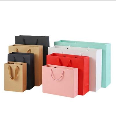 China Recycled Materials Wholesale Retail Shopping Paper Packaging Bag Custom Logo Paper Bag With Ribbon Handle for sale