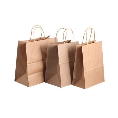 China Recycled Materials Wholesale Brown Kraft Paper Gift Bags With Handles Bulk Goods Paper Shopping Bags for sale