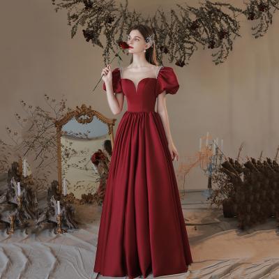 China 2022 New Arrival Cute Breathable Princess Styles Bandage Puff Sleeve Satin Backless Red Wedding Dresses for sale