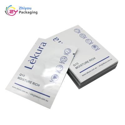 China Custom Plastic Barrier Facial Scrub Cosmetic Cream Packaging Empty Sachet Foil Bag for sale