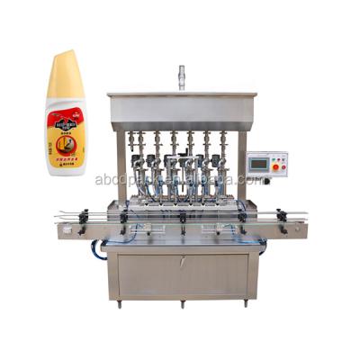 China Oval Beverage Bottle Filler For Shoe Polish Oils Four Heads Full Automatic Liquid Filling Machine for sale