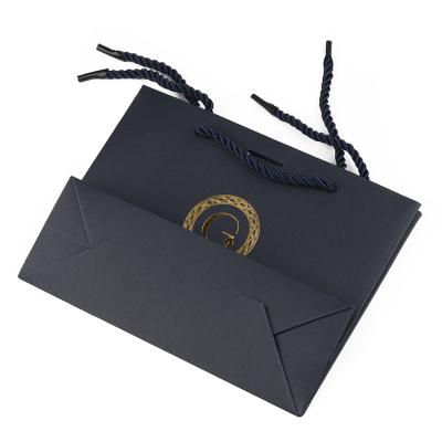 China Biodegradable Hot Selling Luxury Logo Custom Paper Bag for sale