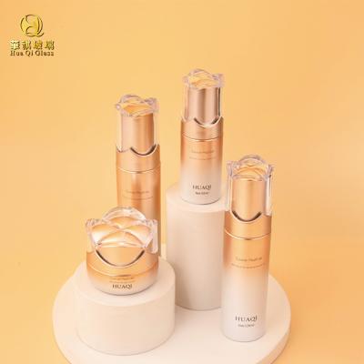 China Glass Bottles Wholesale Cosmetic Set Glass Bottles Handmade Skincare Packaging Cream Essential Oil Glass Bottles With Pump Head for sale