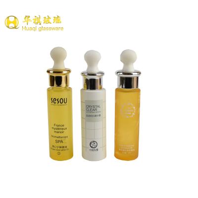 China Glass Bottles 30ml Transparent Yellow Glass Bottle With Cosmetic Dropper Packaging for sale