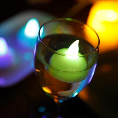 China Home Decoration Flameless Christmas Tealight Yellow Flickering Halloween Led Sensor Floating Candle for sale