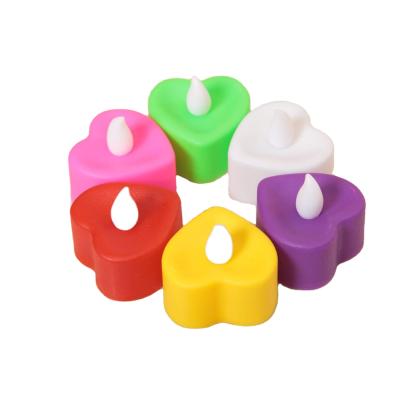 China Beautiful Flameless Heart Shape Electronic Flameless LED Wedding Decoration Candles Batteries Tea Light for sale