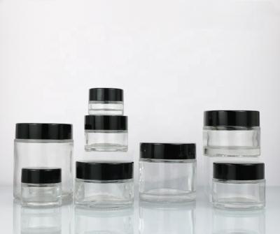 China Cosmetic-Customized cosmetic bottle round glass jars cosmetic storage jar glass container with lids thick wall glass jar for sale