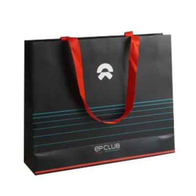 China Recyclable Wholesale Custom Printed Black Luxury Shopping Paper Gift Bag With Handle for sale