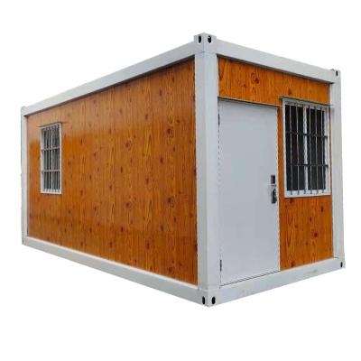 China Modern Wooden Grain Color Flat Pack Container Prefab House for sale