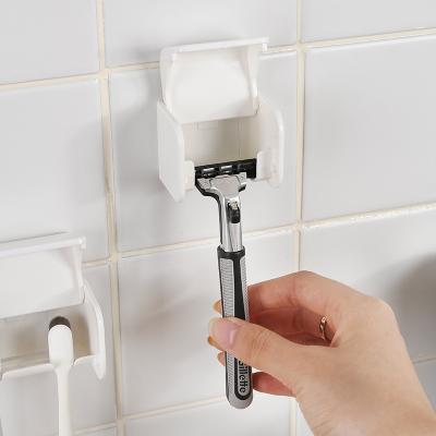 China Viscosity Bathroom Shower Hanger Men Women Razor Stand Strong Self-adhesive Durable Men's Razor Holder Shelf for sale