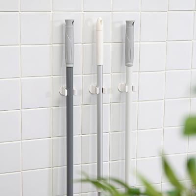 China New Viable Wall Mounted Broom Hole Mounted Broom Holder Umbrella Hook Holder Free Hole Hanger Broom Brush Holder for sale