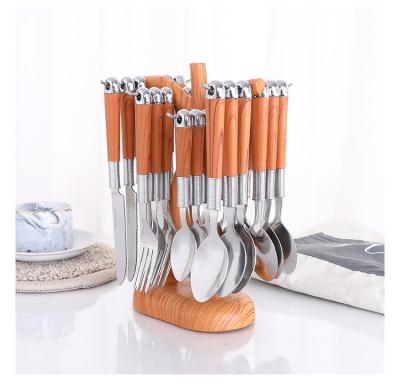 China Sustainable Creative Wooden Handle Stainless Steel Flatware Set Knife Fork Serving 24 Piece Portable Spoon Cutlery Set With Cutlery Rack for sale