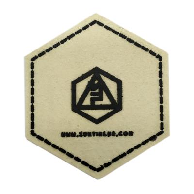 China Washable personalized leather logo garment patch custom embossed jeans leather patch label for clothing for sale