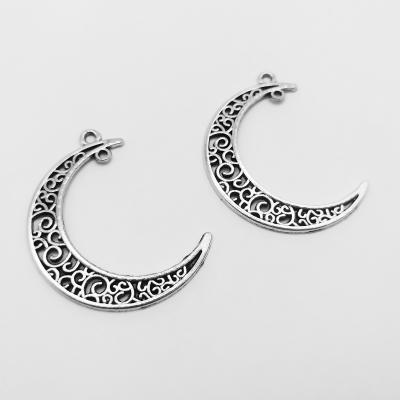 China FASHIONABLE High Quality Zinc Alloy Metal Making Accessories Metal Double Hole Hollowing Out Crescent Shape Charm Pendant Jewelry for sale