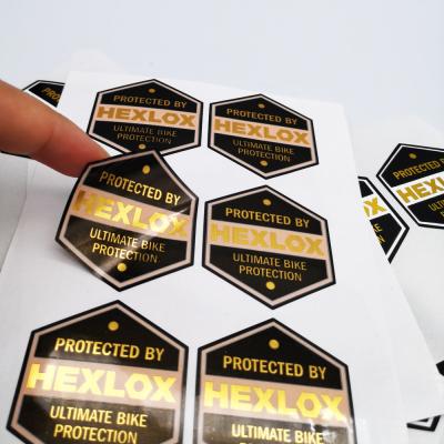 China Customized Printing Clear Stickers Self Adhesive Logo Waterproof Custom Hot Selling Transparent Gold Foil Label for sale