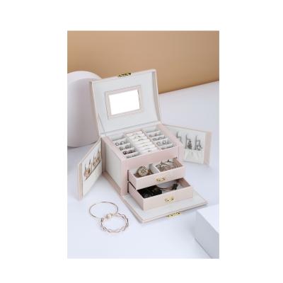 China Simple Type Recyclable Jewelry Storage Box Creative Disk Jewelry Box Ring Drawer Silk Jewelry Box for sale